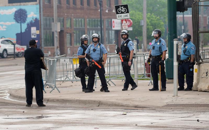 Man exchange words with police outside the 3rd precinct, Minneapolis, Minnesota, May 28, 2020