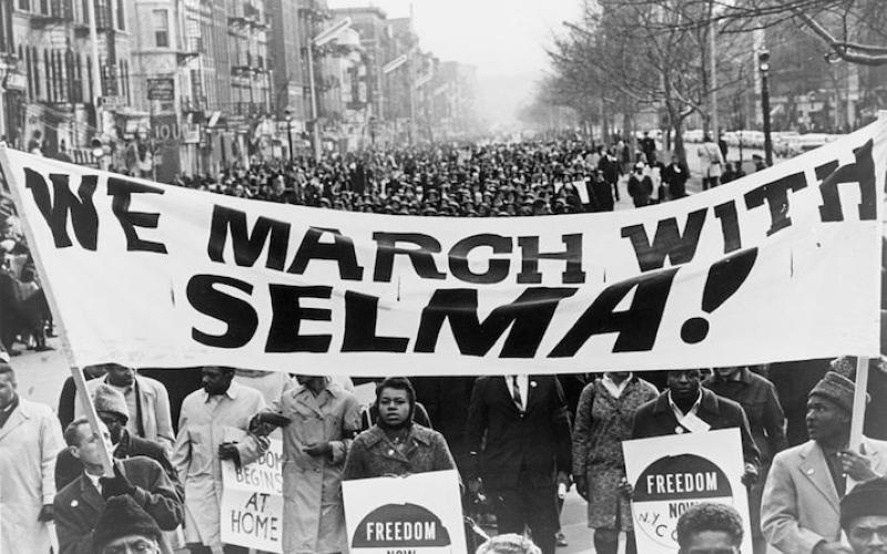 marchers carrying banner "We march with Selma!" on street in Harlem, New York City, New York, 15 March 1965
